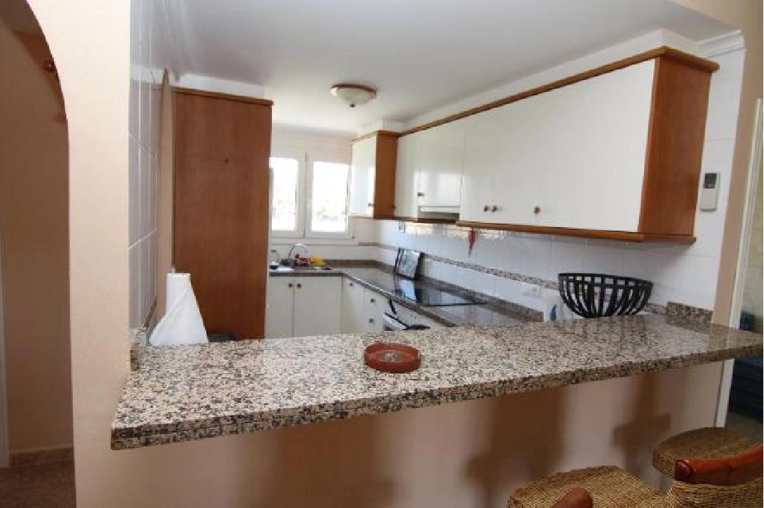 Kitchen with serving hatch to dining room